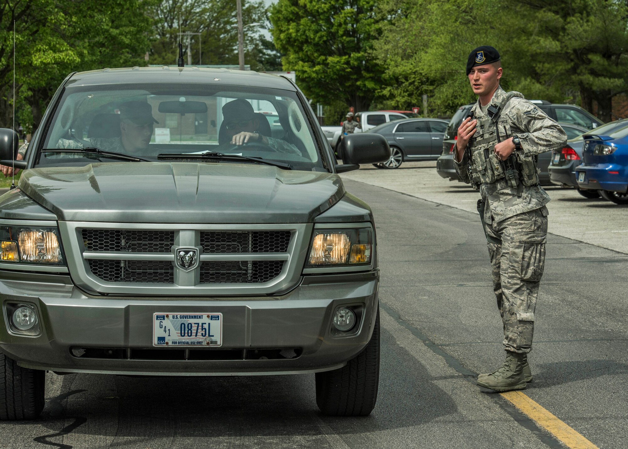 Airman 1st Class Rodolfo Escobar, 375th Security Forces Squadron, controls an entry control point during an exercise, Scott Air Force Base, Ill., April 20, 2017. The exercise prepared Scott Air Force Base personnel for air show incident response.  First responders managed over 70 patients and practiced their procedures in the event of an aircraft accident.   (U.S. Air Force photo by Staff Sgt. Jodi Martinez)