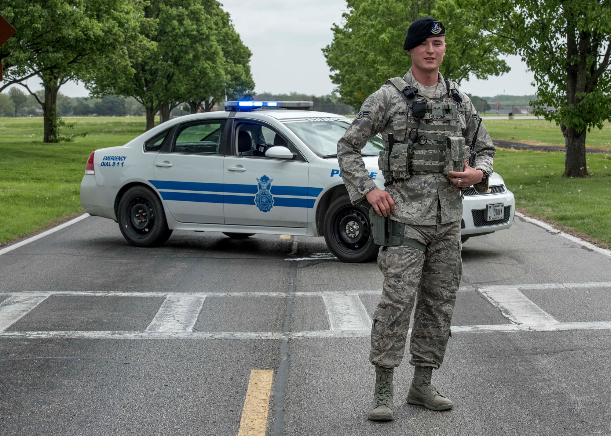 Airman 1st Class Rodolfo Escobar, 375th Security Forces Squadron, controls an entry control point during an exercise, Scott Air Force Base, Ill., April 20, 2017. The exercise prepared Scott Air Force Base personnel for air show incident response.  First responders managed over 70 patients and practiced their procedures in the event of an aircraft accident.   (U.S. Air Force photo by Staff Sgt. Jodi Martinez)