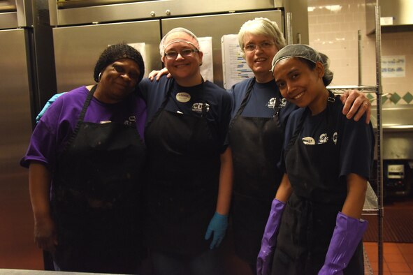 Child Development Center and Youth Center food service workers pose for a photo at the CDC April 24, 2017, at Malmstrom Air Force Base, Mont. The team provides breakfast, lunch and a snack to the CDC and breakfast and a snack to the kids at the Youth Center during the school year and when they are out of school. (U.S. Air Force photo/Senior Airman Jaeda Tookes)

