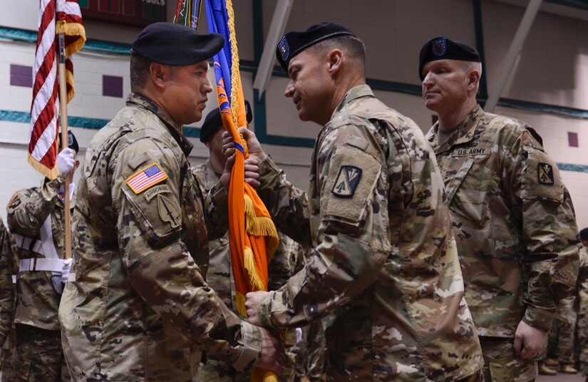 U.S. Army Command Sgt. Maj. Gerado Gonzalez, 128th Aviation Brigade command sergeant major, takes responsibility of the brigade during the passing of the colors at Joint Base Langley-Eustis, Va., April 25, 2017. The passing of the colors ensures the unit is never without leadership and signifies an allegiance from the unit’s Soldiers to their incoming leader. (U.S. Air Force photo/Airman 1st Class Kaylee Dubois)