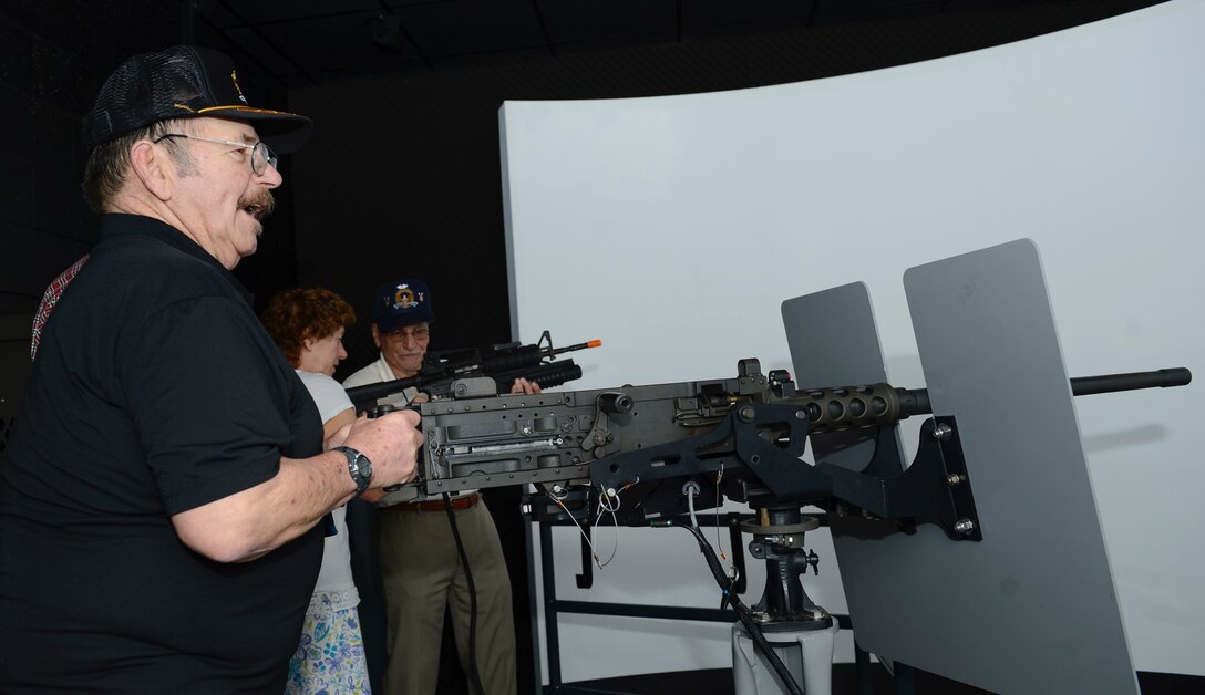 Retired U.S. Army Lt. Col. Barry Gasdek, Legion of Valor member, fires a simulated weapon while touring the Maritime Intermodal Training Department at Joint Base Langley-Eustis, Va., April 21, 2017. The Legion of Valor organization aims to encourage patriotism and provoke interest regarding the Armed Forces in today’s youth. (U.S. Air Force photo/Airman 1st Class Kaylee Dubois)