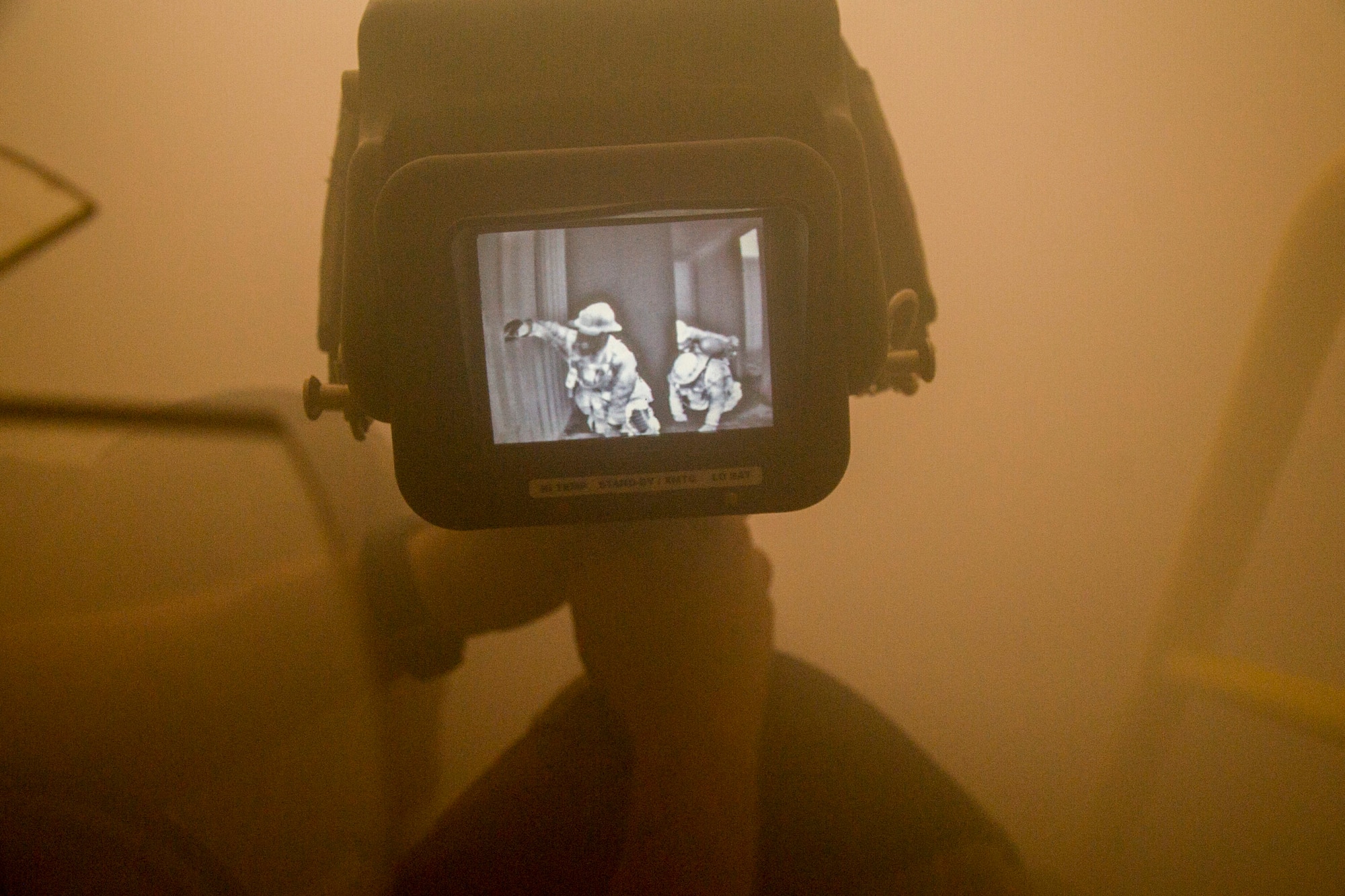 A thermal imaging camera is used to observe students maneuver through a simulated smoked-filled building during the first-ever Air Force Reserve Command Firefighter Rescue and Survival Course at Dobbins Air Reserve Base, Ga., April 18, 2017. Twenty Citizen Airmen participated in the intense 50-hour course held at the 622nd Civil Engineer Group expeditionary combat support-training certification center, which focused on a Rapid Intervention Crew, or RIC. The RIC is a dedicated and specially trained group of firefighters whose responsibilities include safely evacuating a distressed firefighter from a structure. (U.S. Air Force photo by Master Sgt. Theanne K. Herrmann)