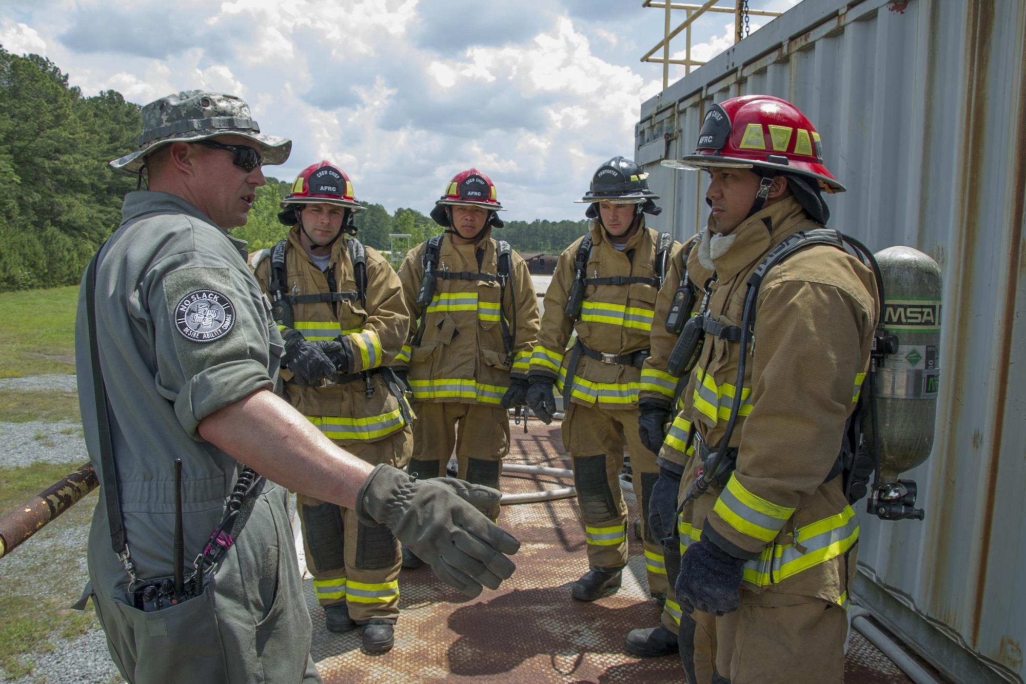 U.S. Air Force Master Sgt. Nick Ward, of Chicago, Illinois, a member of the 434th Civil Engineer Squadron, Grissom Air Reserve Base, explains rescue techniques using a hoseline during the first-ever Air Force Reserve Command Firefighter Rescue and Survival Course at Dobbins Air Reserve Base, Ga., April 18, 2017. Twenty Citizen Airmen participated in the intense 50-hour course held at the 622nd Civil Engineer Group expeditionary combat support-training certification center, which focused on a Rapid Intervention Crew, or RIC. The RIC is a dedicated and specially trained group of firefighters whose responsibilities include safely evacuating a distressed firefighter from a structure. (U.S. Air Force photo by Master Sgt. Theanne K. Herrmann)