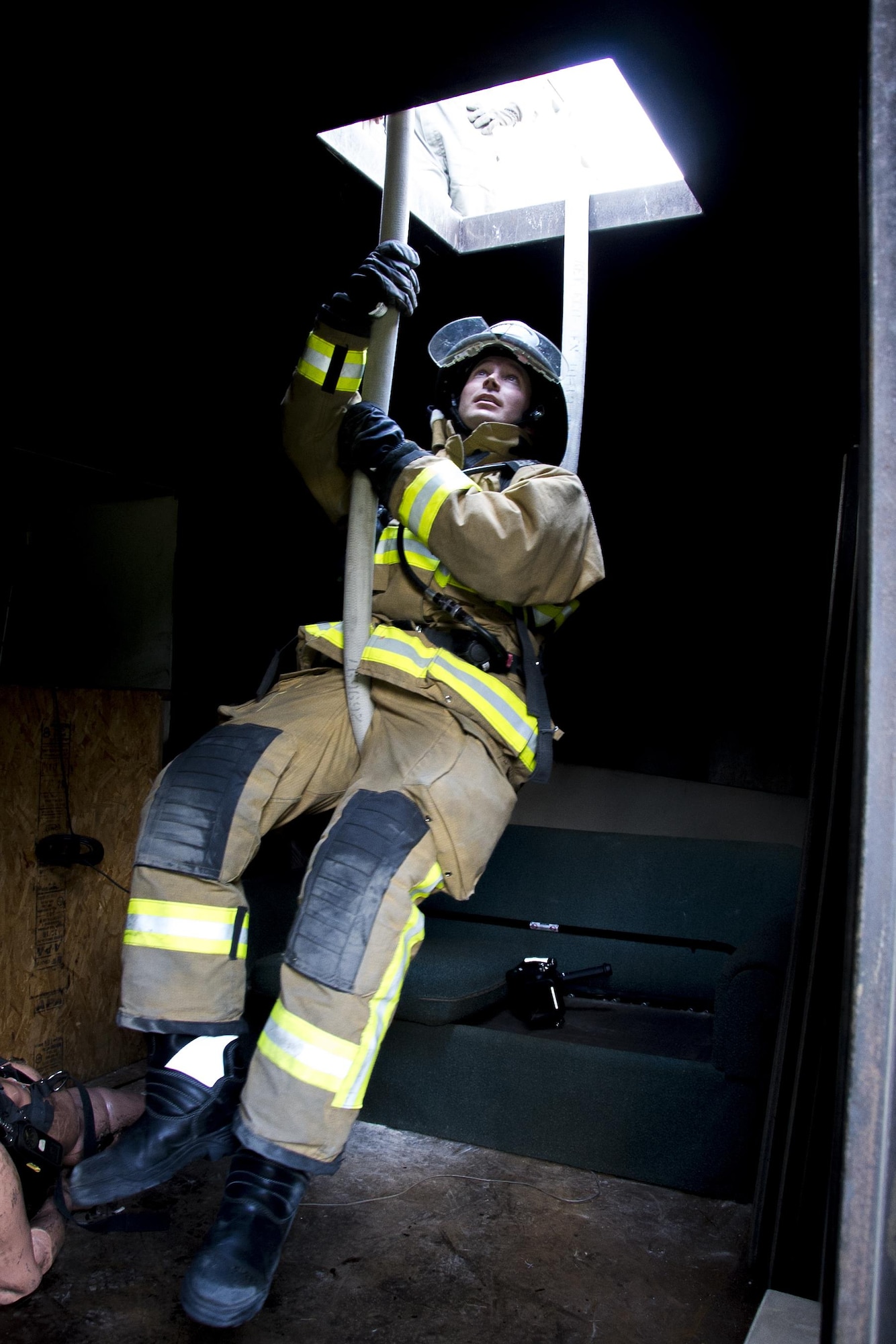 U.S. Air Force Staff Sgt. Tyler Turner, of Columbus, Ohio, and a member of the 445th Civil Engineer Squadron, Wright-Patterson Air Force Base, Ohio, is pulled up by a team of firefighters using the hoseline during the first-ever Air Force Reserve Command Firefighter Rescue and Survival Course at Dobbins Air Reserve Base, Ga., April 18, 2017. Twenty Citizen Airmen participated in the intense 50-hour course held at the 622nd Civil Engineer Group expeditionary combat support-training certification center, which focused on a Rapid Intervention Crew, or RIC. The RIC is a dedicated and specially trained group of firefighters whose responsibilities include safely evacuating a distressed firefighter from a structure. (U.S. Air Force photo by Master Sgt. Theanne K. Herrmann)