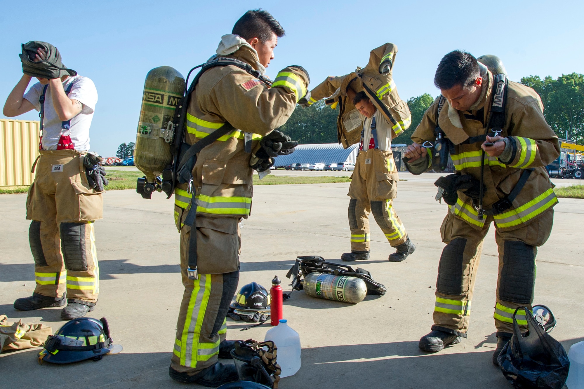 A team of Air Force Reserve firefighters prepare for a training scenario during the first-ever Air Force Reserve Command Firefighter Rescue and Survival Course at Dobbins Air Reserve Base, Ga., April 18, 2017. Twenty Citizen Airmen participated in the intense 50-hour course held at the 622nd Civil Engineer Group expeditionary combat support-training certification center, which focused on a Rapid Intervention Crew, or RIC. The RIC is a dedicated and specially trained group of firefighters whose responsibilities include safely evacuating a distressed firefighter from a structure. (U.S. Air Force photo by Master Sgt. Theanne K. Herrmann)