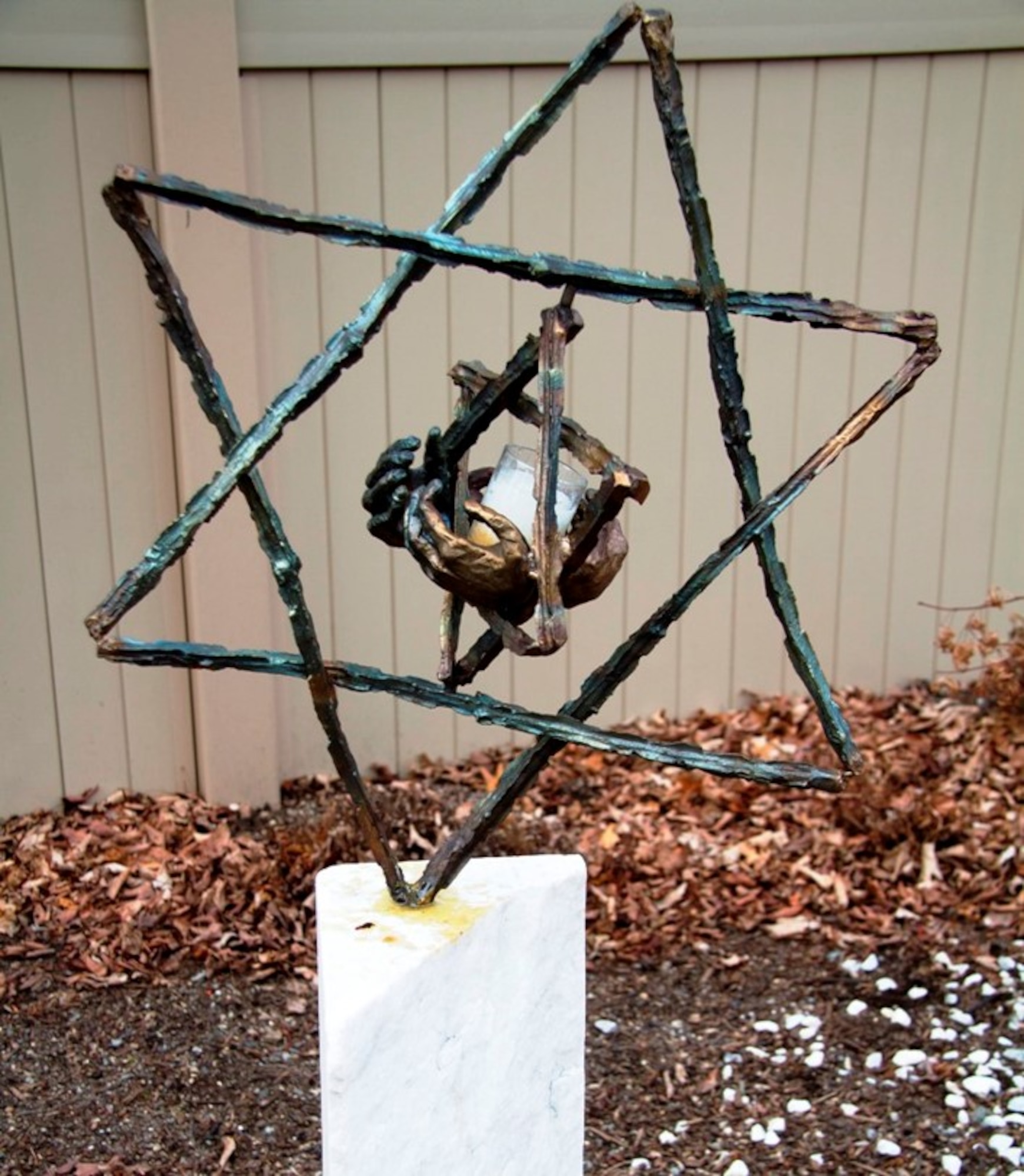 Fred Manasse, a survivor of the Holocaust, donated this sculpture he created to a cemetery in Milton, Massachusetts in 2012, where it was stolen in September 2016 and now is in the process of being replaced. The two Stars of David commemorate his sister and 1.5 million other child victims of the holocaust.  (Photo courtesy of Fred Manasse)