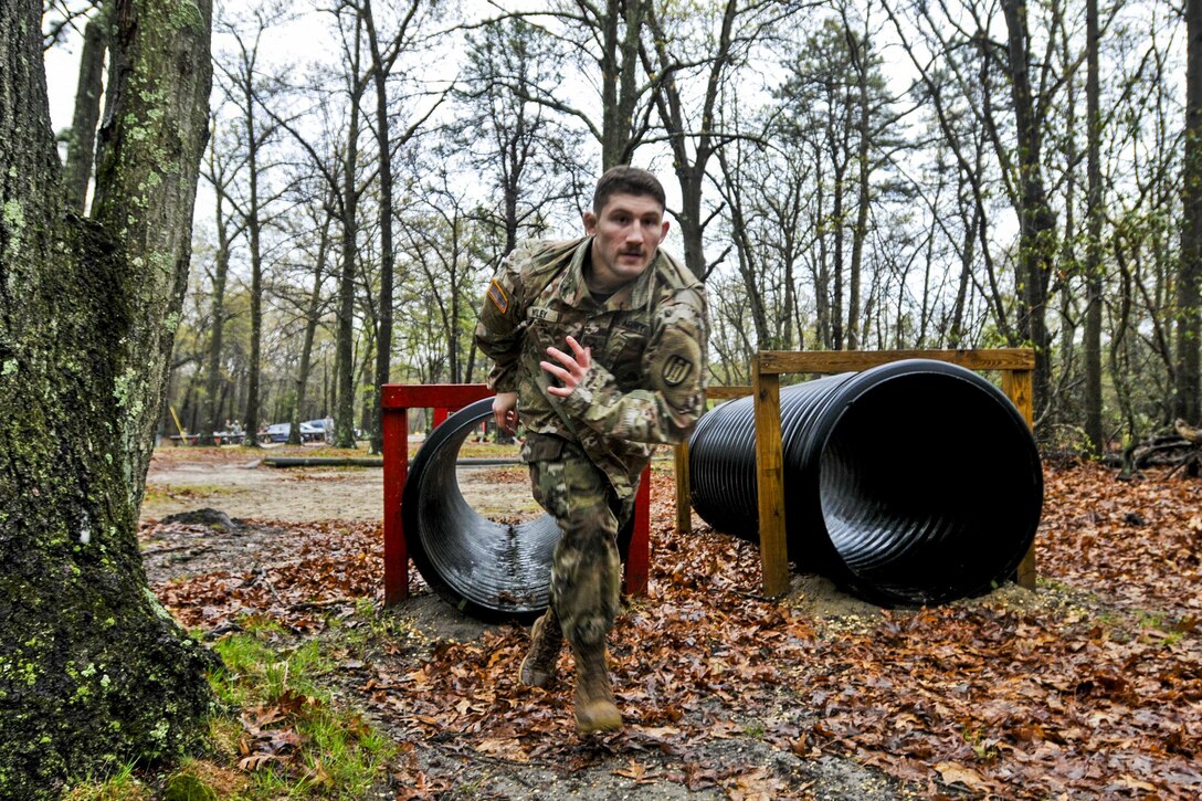 Army Pfc. Toby Mosley sprints from a tunnel during the obstacle course portion of the Combined Best Warrior Competition at Joint Base McGuire-Dix-Lakehurst, N.J., April 25, 2017. Mosley is assigned to the 428th Engineer Company, 397th Engineer Battalion, 372nd Engineer Brigade, 416th Theater Engineer Command. Army photo by Staff Sgt. Roger Ashley