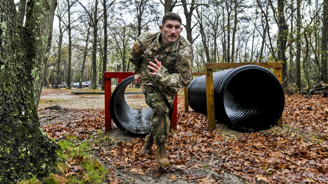 Army Pfc. Toby Mosley sprints from a tunnel during the obstacle course portion of the Combined Best Warrior Competition at Joint Base McGuire-Dix-Lakehurst, N.J., April 25, 2017. Mosley is assigned to the 428th Engineer Company, 397th Engineer Battalion, 372nd Engineer Brigade, 416th Theater Engineer Command. Army photo by Staff Sgt. Roger Ashley