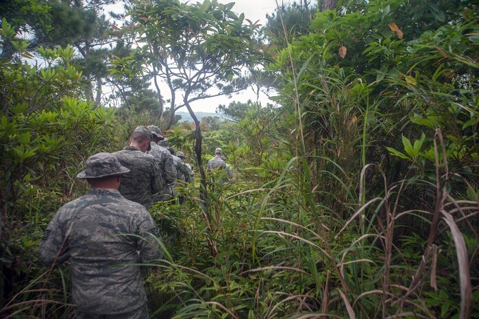 U.S. Air Force Airmen assigned to the 18th Medical Group navigate a jungle as part of the Preventative Aerospace Medicine Convention April 21, 2017, at Kadena Air Base, Japan. Correctly and safely navigating potentially dangerous terrain was one of the focal points of the PAMACON. 