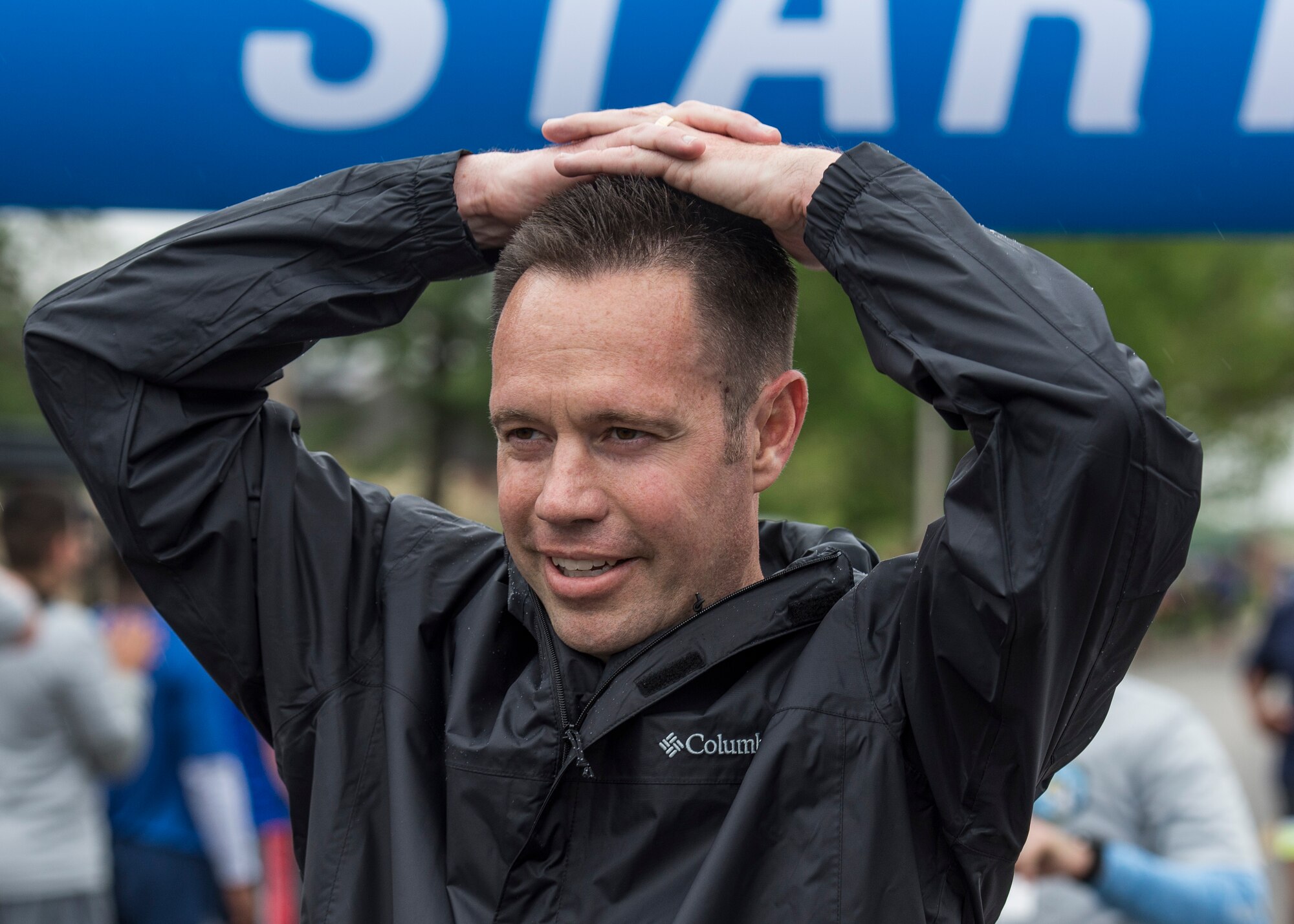 A Team Scott member puts his hand over his head to catch his breath after completing the Race Through Scott’s Past at Scott Air Force Base, Illinois, April 21, 2017. The 5k race took participants past historical buildings that are located here at Scott.( U.S. Air Force photo by Airman Chad Gorecki)