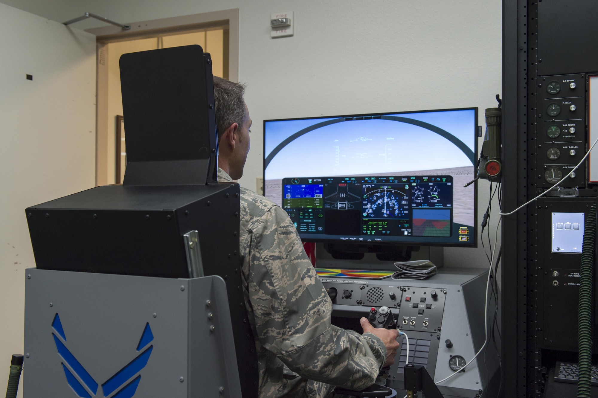 Col. Scott Cain, 412th Operations Group commander, tries out the new hypoxia trainer at the Aircrew Flight Equipment building April 20. The Reduced Oxygen Breathing Device will allow Edwards pilots and aircrew members to complete required training on recognizing their own unique symptoms of hypoxia and how to recover from it. (U.S. Air Force photo by Kyle Larson)