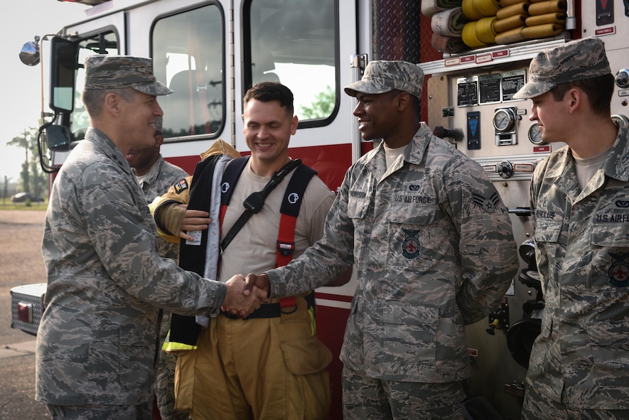 Maj. Gen. Thomas Bussiere, 8th Air Force commander, visits with 2nd Civil Engineer Squadron firefighters at Barksdale Air Force Base, La., April 21, 2017. The 2nd Civil Engineer Squadron Fire Department provides support to the 2nd Bomb Wing, 8th Air Force Headquarters and Air Force Global Strike Command Headquarters. (U.S. Air Force photo/Airman 1st Class Sydney Bennett)