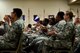 Airmen from the 8th Air Force attend a commander’s call at Barksdale Air Force Base, La., April 21, 2017. During the commander’s call, the 8th Air Force commander, Maj. Gen. Thomas Bussiere, spoke about Airmanship, heritage and the future of the 8th Air Force. (U.S. Air Force photo/Airman 1st Class Sydney Bennett)
