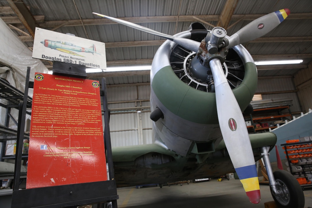 The Douglas SBD-1 Dauntless, which is currently being restored by Robert Cramsie, a restoration volunteer and a board member with the Flying Leatherneck Historical Foundation, parked at the Flying Leatherneck Aviation Museum Restoration Facility at Marine Corps Air Station Miramar, Calif., since December 2012. Cramsie, a retired aircraft mechanic, spent more than 2,500 hours restoring the last-of-its-kind aircraft using blueprints and parts fabricated from scratch. (U.S. Marine Corps photo by Lance Cpl. Jake McClung/Released)