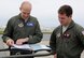 U.S. Air Force Maj. Jacob Johnson, 909th Air Refueling Squadron director of wing inspections, and 1st Lt. Huston Harrison, 909th ARS standards and evaluations liaison officer, review a pre-flight checklist April 20, 2017 at Kadena Air Base, Japan. Pre-flight checks ensure aircraft are safe for flight and can carry out designated missions. (U.S. Air Force photo by Senior Airman Lynette M. Rolen)