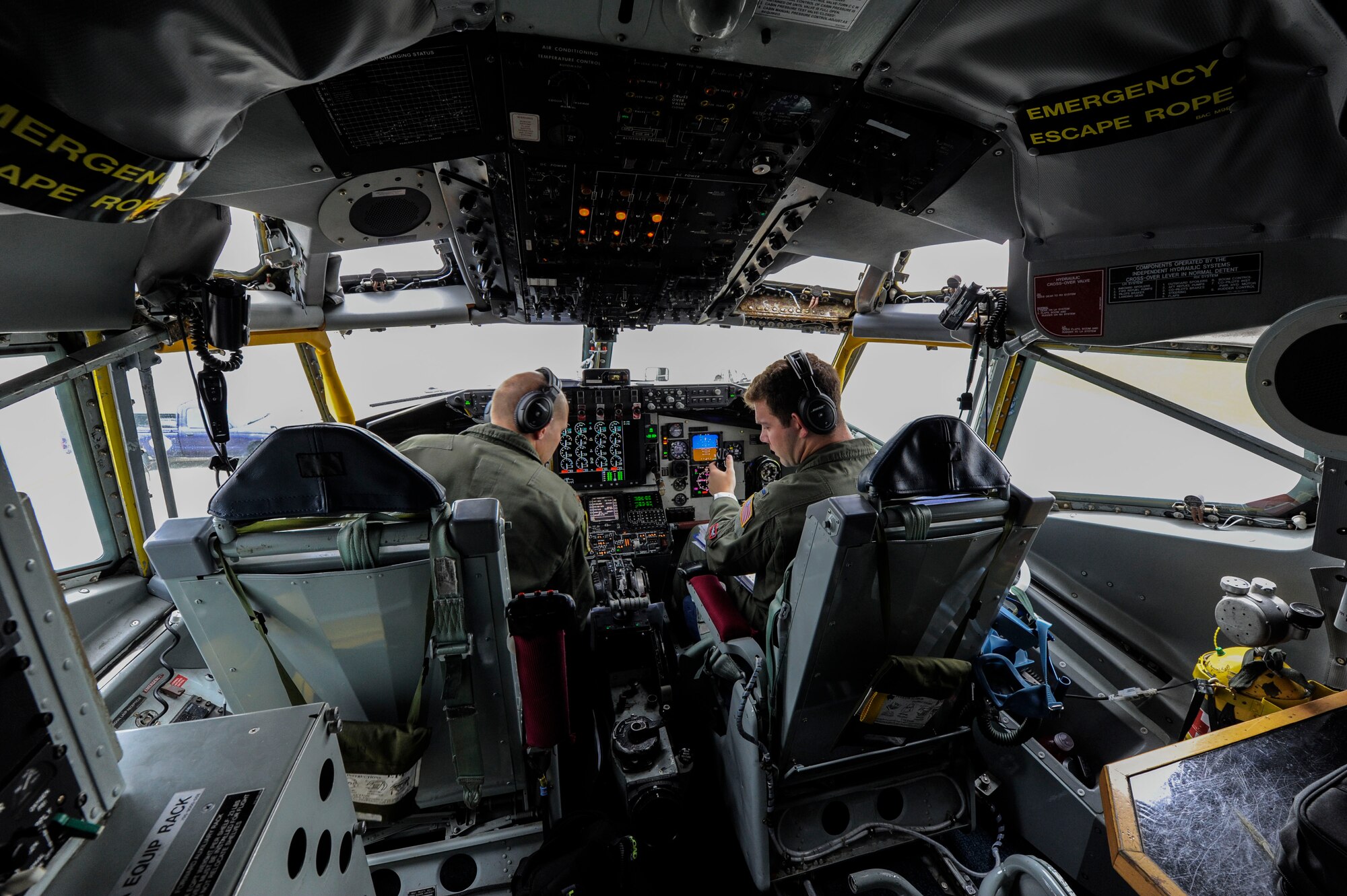 U.S. Air Force Maj. Jacob Johnson, 909th Air Refueling Squadron director of wing inspections and 1st Lt. Huston Harrison, 909th ARS standards and evaluations officer, conduct pre-flight checks aboard a KC-135 Stratotanker April 20, 2017, at Kadena Air Base, Japan. The KC-135 is the primary refueling aircraft for the Air Force, capable of supporting peacetime and contingency operations. (U.S. Air Force photo by Senior Airman Lynette M. Rolen)