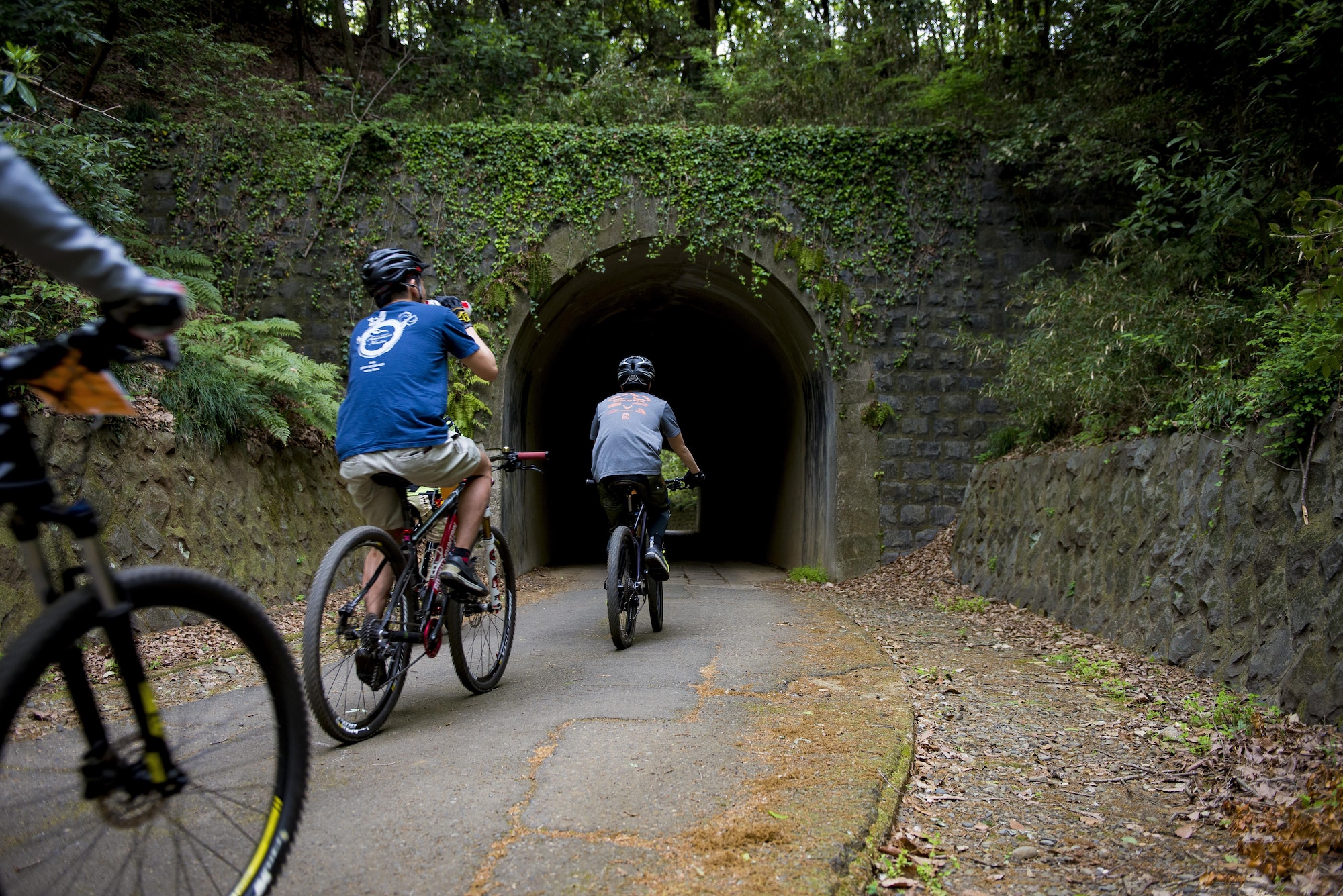 Participants in the Tour de Tama mountain bike race ride through a tunnel April 22, 2017, at Tama Hills Recreation Area, Japan. The course was approximately three miles in length and an approximate 3000 feet in combined elevation gain. (U.S. Air Force photo by Airman 1st Class Donald Hudson)