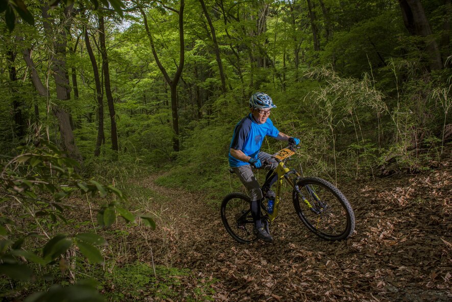 A participant in the Tour de Tama mountain bike race peddles uphill April 22, 2017, at Tama Hills Recreation Area, Japan. The course was approximately three miles in length and an approximate 3000 feet in combined elevation gain. (U.S. Air Force photo by Airman 1st Class Donald Hudson)