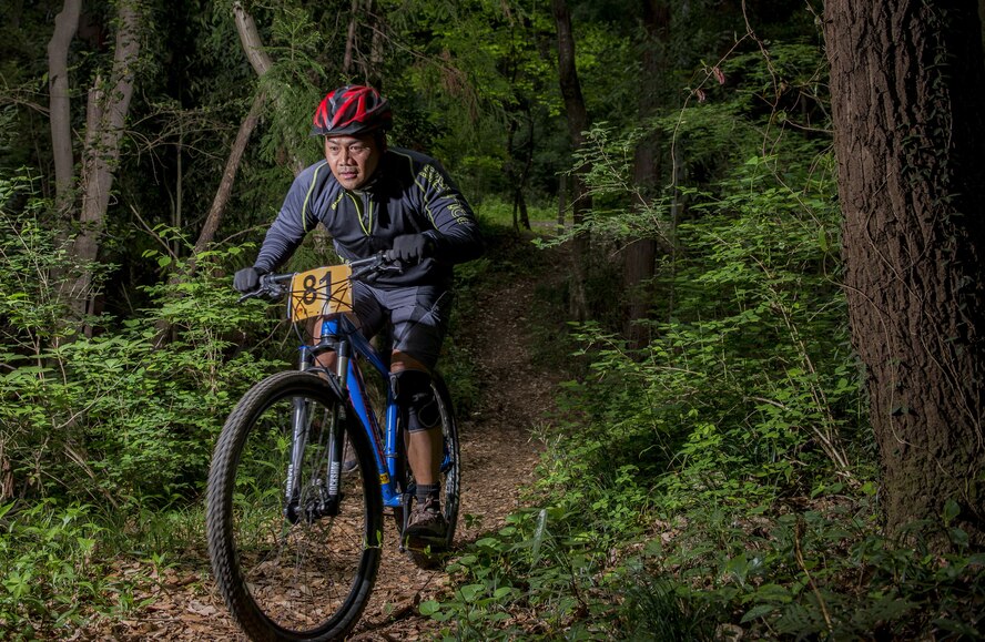 A participant in the Tour de Tama mountain bike race rides through forest April 22, 2017, at Tama Hills Recreation Area, Japan. Over 85 people participated in the race with the youngest competitor being 13-years old, and the oldest was 64-years old. (U.S. Air Force photo by Airman 1st Class Donald Hudson)