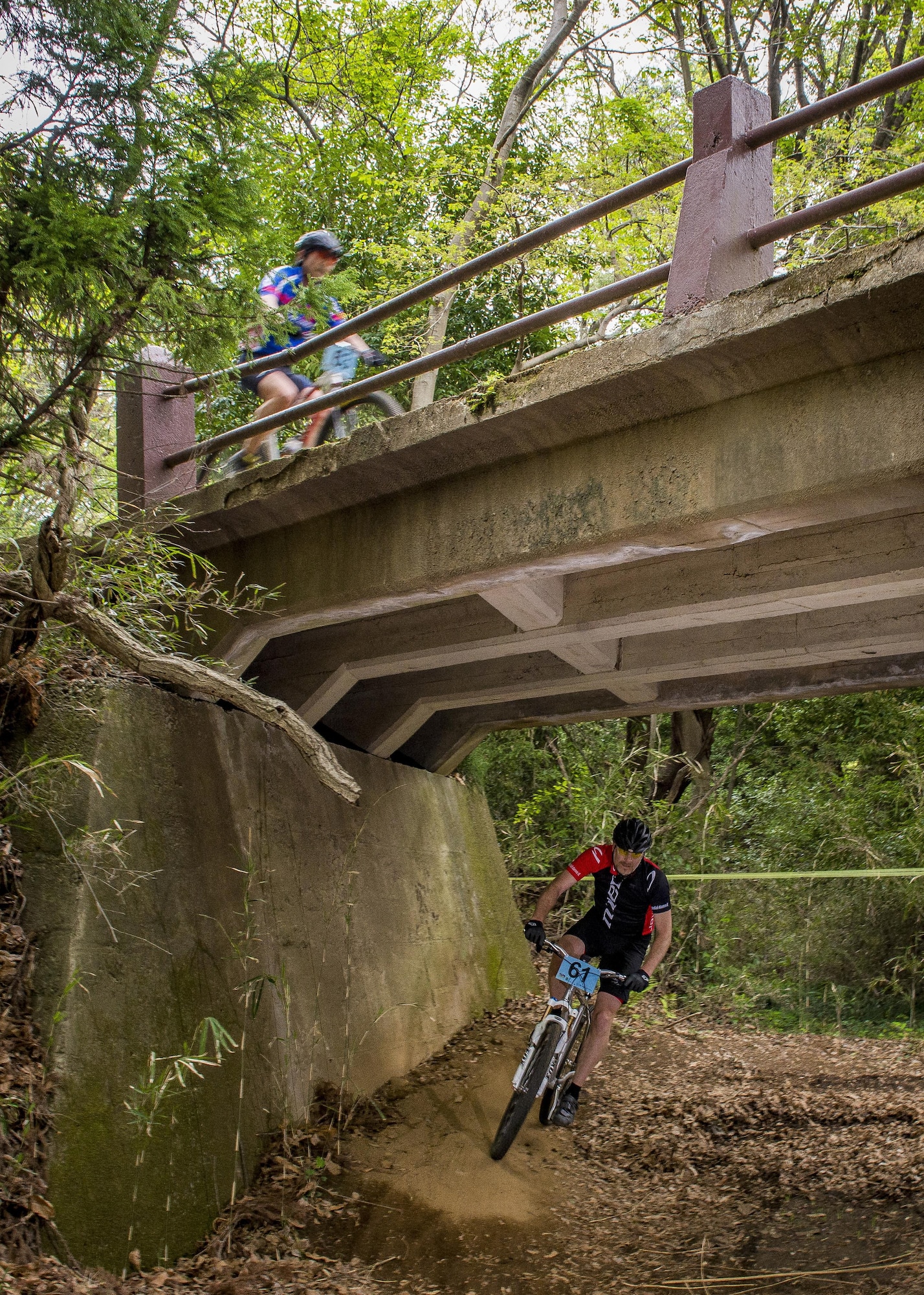 Participants in the Tour de Tama mountain bike race ride over and under bridge April 22, 2017, at Tama Hills Recreation Area, Japan. The race was open to everyone, with civilians able to register at local bike shops throughout the Tokyo Metropolitan area and military personnel were able to register at the Outdoor Recreation Center. (U.S. Air Force photo by Airman 1st Class Donald Hudson)