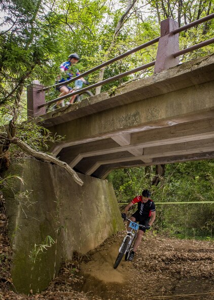 Participants in the Tour de Tama mountain bike race ride over and under bridge April 22, 2017, at Tama Hills Recreation Area, Japan. The race was open to everyone, with civilians able to register at local bike shops throughout the Tokyo Metropolitan area and military personnel were able to register at the Outdoor Recreation Center. (U.S. Air Force photo by Airman 1st Class Donald Hudson)
