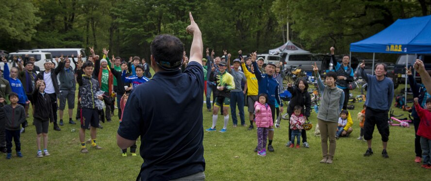 Participants in the Tour de Tama mountain bike race and their families play rock, paper, and scissors for a prize April 22, 2017, at Tama Hills Recreation Area, Japan. After the race prizes were raffled off and lunch was provided for the participants and their families. (U.S. Air Force photo by Airman 1st Class Donald Hudson)
