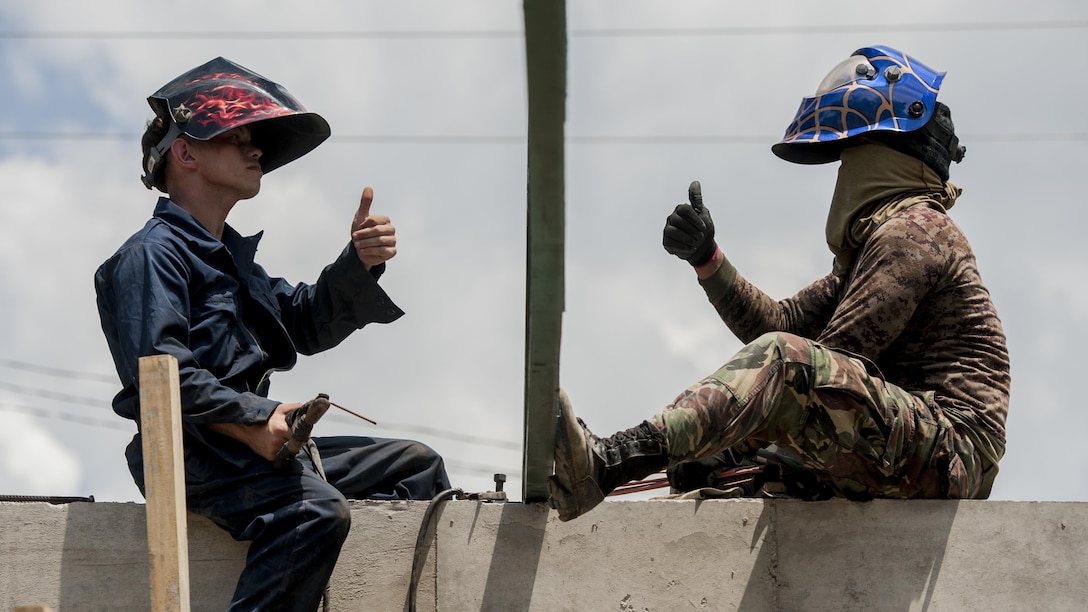 U.S. Marine Lance Cpl. Thomas Whitworth and Philippine Army Pfc. Usabel Aljen weld roof supports during Balikatan 2017 in Ormoc City, Leyte, April 23, 2017. Armed Forces of the Philippines and U.S. military engineers worked together to build a new classroom at Don Carlos Elementary School in Ormoc City. Balikatan is an annual U.S.-Philippine military bilateral exercise focused on a variety of missions, including humanitarian assistance and disaster relief and counterterrorism. 