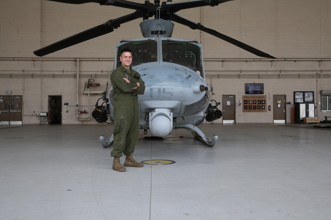 Cpl. Tyler Eddy, an airframes mechanic with Marine Light Attack Helicopter Squadron (HMLA) 169, stands in front of a UH-1Y Huey at Marine Corps Air Station Camp Pendleton, Calif., April 24. In July 2017, Eddy is expected to complete his active-duty enlistment with the Marine Corps and pursue a doctorate in physics at Princeton University in Princeton, N.J. (U.S. Marine Corps photo by Lance Cpl. Jake M.T. McClung/Released)