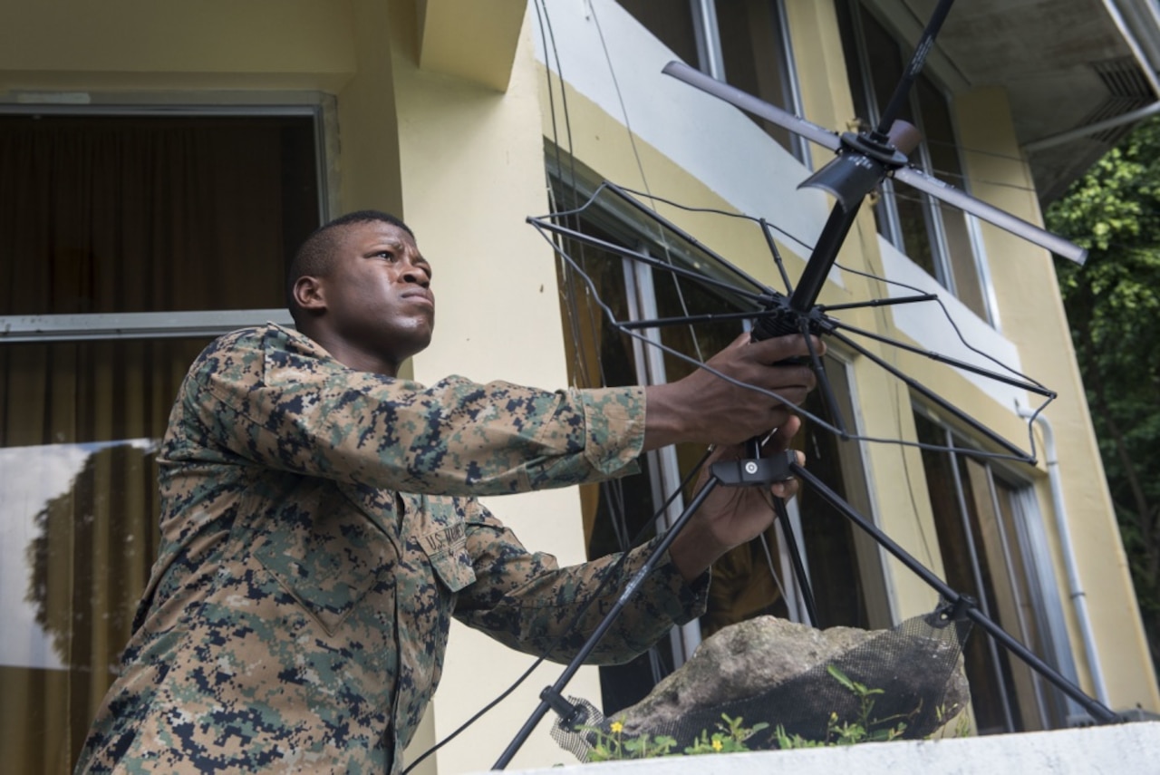 U.S. Marine Staff Sgt. Alexander Davis adjusts a satellite communication antenna during Balikatan 2017 at Camp Lapulapu, Cebu, April 25, 2017. Balikatan is an annual U.S.-Philippine military bilateral exercise focused on a variety of missions, including humanitarian assistance and disaster relief, and counterterrorism.