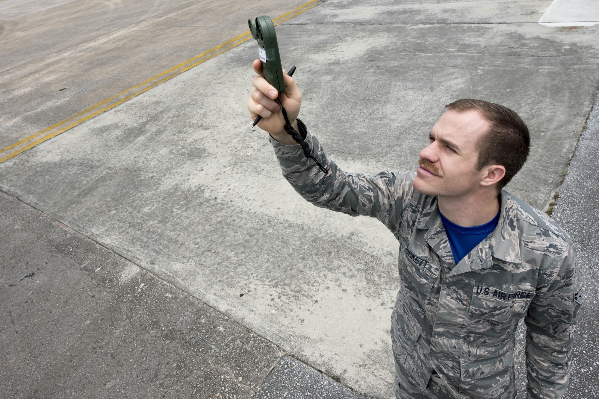 U.S. Air Force Airman 1st Class Joshua Tuckett, 18th Operations Support Squadron weather flight weather apprentice, conducts weather observation using a kestrel reader April 21, 2017, at Kadena Air Base, Japan. The kestrel is used to measure air pressure, relative humidity, wind speed and direction. (U.S. Air Force photo by Senior Airman John Linzmeier)