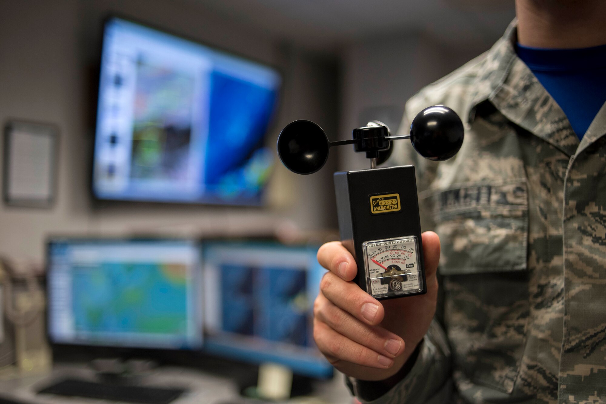U.S. Air Force Airman 1st Class Joshua Tuckett, 18th Operations Support Squadron weather flight weather apprentice, holds an anemometer April 21, 2017, at Kadena Air Base, Japan. Manual devices such as the anemometer were used to measure wind speeds, but have since been replaced by automated systems that can provide instant data to forecasters. (U.S. Air Force photo by Senior Airman John Linzmeier)