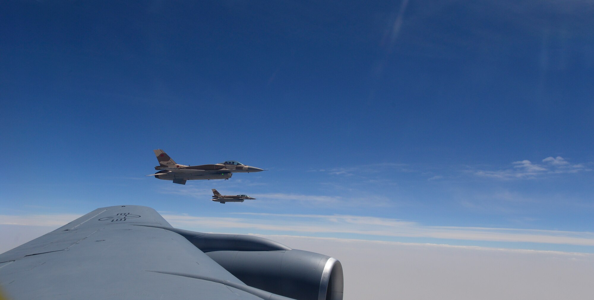 Moroccan F-16 Fighting Falcons fly off the wing of a U.S. Air Force KC-135 Stratotanker assigned to the 100th Air Refueling Wing from RAF Mildenahall, England, over Morocco, during exercise African Lion on April 18, 2017. African Lion is a multinational exercise focused on enhancing professional relationships and strengthening regional security. (U.S. Air Force photo by Staff Sgt. Micaiah Anthony)
