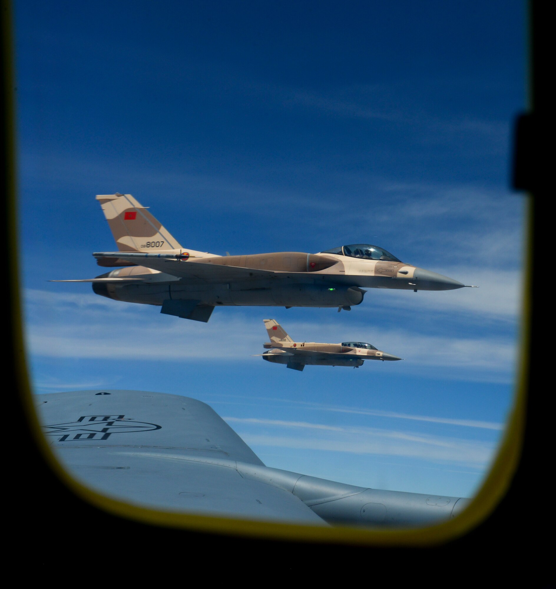 Moroccan F-16 Fighting Falcons fly off the wing of a U.S. Air Force KC-135 Stratotanker assigned to the 100th Air Refueling Wing from RAF Mildenhall, England, over Morocco during exercise African Lion on April 18, 2017. The F-16 is a compact, highly maneuverable multi-role fighter aircraft capable of air to air combat and air to surface attack. (U.S. Air Force photo by Staff Sgt. Micaiah Anthony)