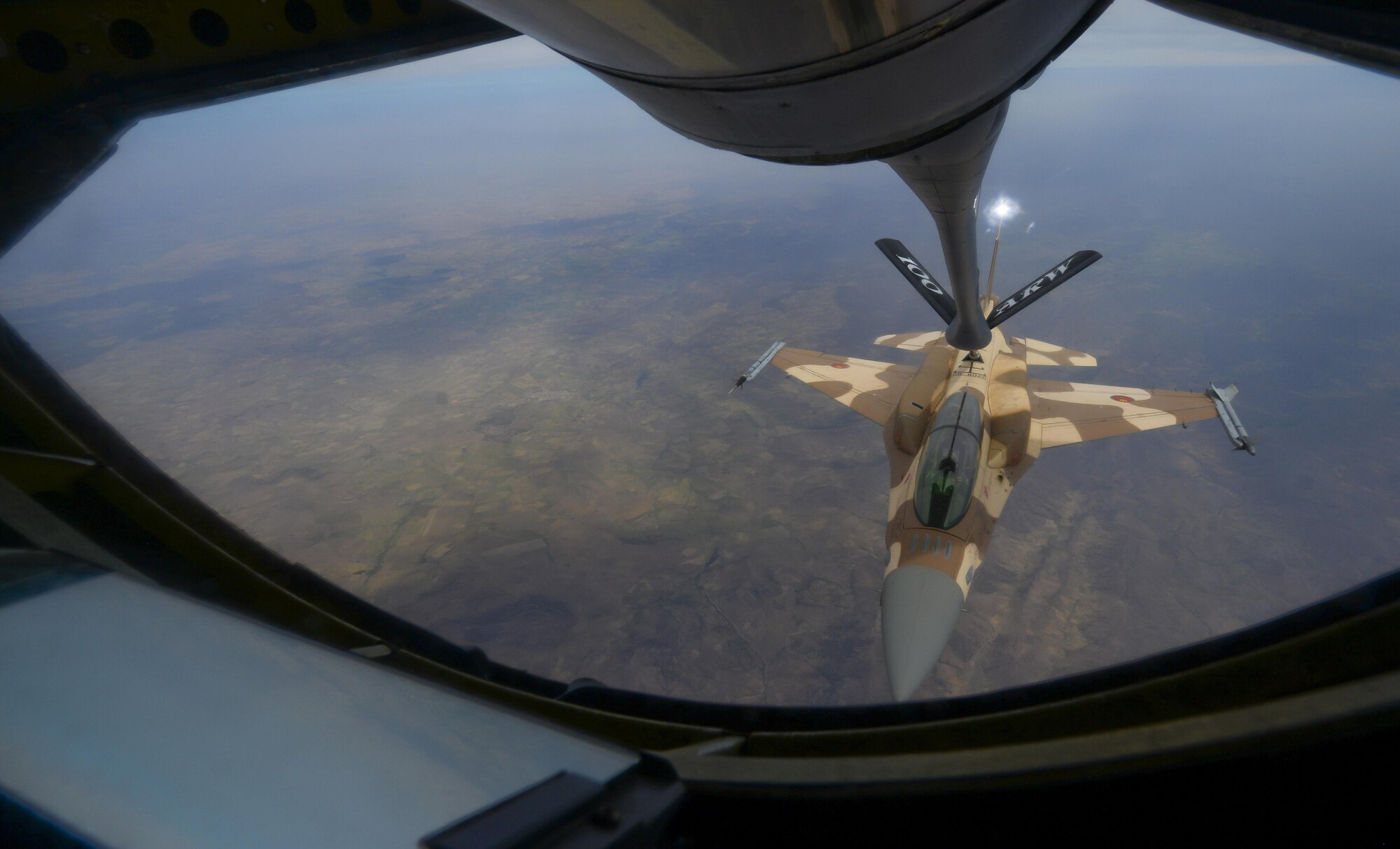 A Moroccan F-16 Fighting Falcon receives fuel from a U.S. Air Force KC-135 Stratotanker assigned to the 100th Air Refueling Wing from RAF Mildenhall, England, during exercise African Lion on April 18, 2017, over Morocco. The maximum transfer fuel load of a KC-135 is 200,000 pounds, however F-16's are capeable of carrying 7,000 to 12,000 pounds of fuel. (U.S. Air Force photo by Staff Sgt. Micaiah Anthony)