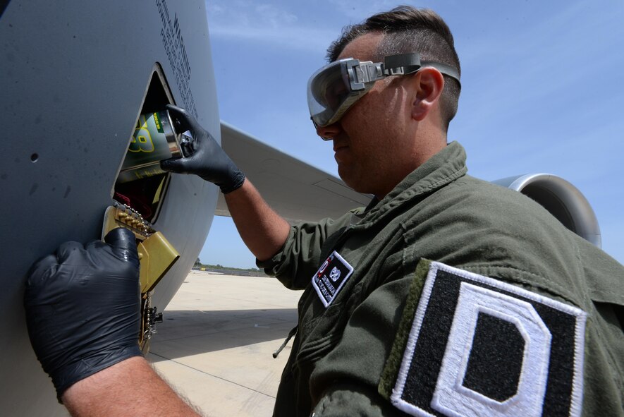 U.S. Air Force Senior Airman Brian Noon, 100th Aircraft Maintenance Squadron crew chief, puts oil in the number two engine of a KC-135 Stratotanker April 19, 2017, on the flightline at Rota Naval Air Station, Spain. Crew chiefs inspect the aircraft after every flight to ensure the tanker is ready to support its next mission.  (U.S. Air Force photo by Staff Sgt. Micaiah Anthony)