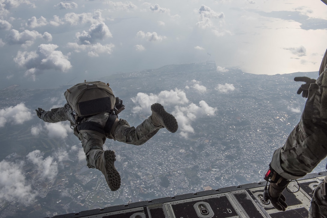 U.S. Air Force Airmen conduct a high altitude, low opening jump off an MC-130J Commando II April 24, 2017, above Okinawa, Japan. (U.S. Air Force photo by Senior Airman John Linzmeier)