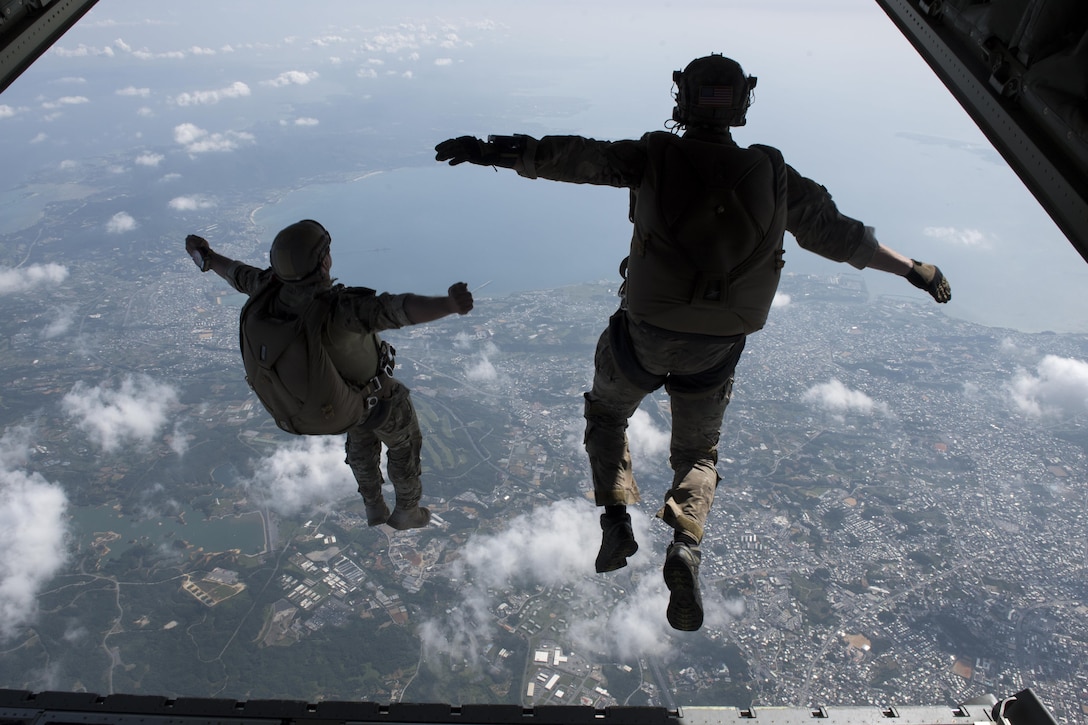 U.S. Army Soldiers conduct a high altitude, low opening jump off an MC-130J Commando II April 24, 2017, above Okinawa, Japan. High Altitude, low opening training prepares joint forces to rescue and recover U.S. and allied partners in times of danger or extreme duress. (U.S. Air Force photo by Senior Airman John Linzmeier)