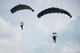 U.S. Air Force Airmen and U.S. Army Soldiers conduct parachute training April 24, 2017, above Kadena Air Base, Japan. Parachute capabilities enable Airmen and Soldiers to perform rescue operations and humanitarian missions in locations where aircraft cannot land. (U.S. Air Force photo by Senior Airman Omari Bernard)