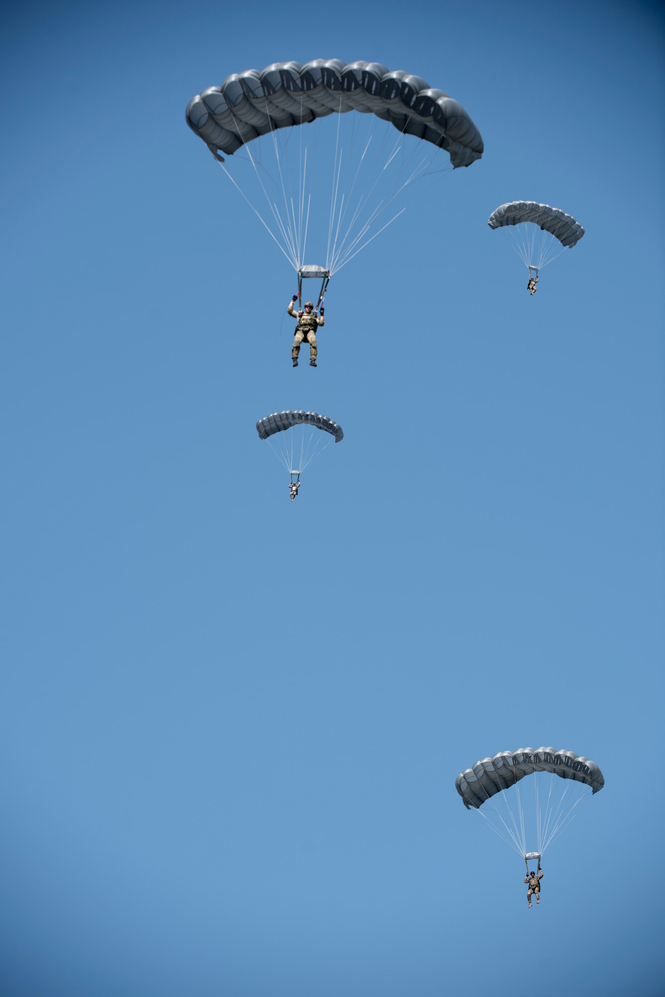 U.S. Air Force Airmen and U.S. Army Soldiers conduct parachute training April 24, 2017, above Kadena Air Base, Japan. Soldiers and Airmen stationed on Okinawa must retain their proficiency in jump operations through constant practice. (U.S. Air Force photo by Senior Airman Omari Bernard)