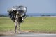 A U.S. Air Force Airman carries parachute gear after conducting a high altitude, low opening jump April 24, 2017, at Kadena Air Base, Japan. Soldiers and Airmen rely on properly prepared parachutes to safely land and conduct operations. (U.S. Air Force photo by Senior Airman Omari Bernard)