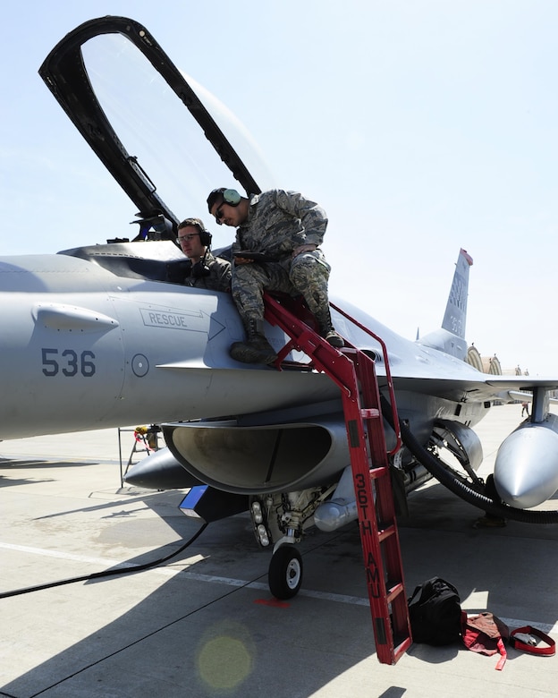 U.S. Air Force Airman 1st Class Kyle Greyhock and Senior Airman Eric Flores-Meza, 36th Aircraft Maintenance Unit avionics technicians, perform maintenance on an F-16 Fighting Falcon during Exercise MAX THUNDER 17 at Kunsan Air Base, Republic of Korea, April 26, 2017. In Max Thunder, U.S. and ROK air forces consistently train together to be ready around-the-clock to defend the Republic of Korea. (U.S. Air Force photo by Staff Sgt. Chelsea Sweatt/Released)