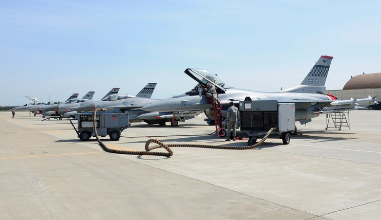Airmen from the 36th Aircraft Maintenance Unit perform maintenance on F-16 Fighting Falcons during Exercise MAX THUNDER 17 at Kunsan Air Base, Republic of Korea, April 26, 2017. This large-scale employment exercise increases the U.S. and ROK’s ability to work together shoulder-to-shoulder and ultimately enhances the U.S. and ROK capability to maintain peace in the region. (U.S. Air Force photo by Staff Sgt. Chelsea Sweatt/Released)