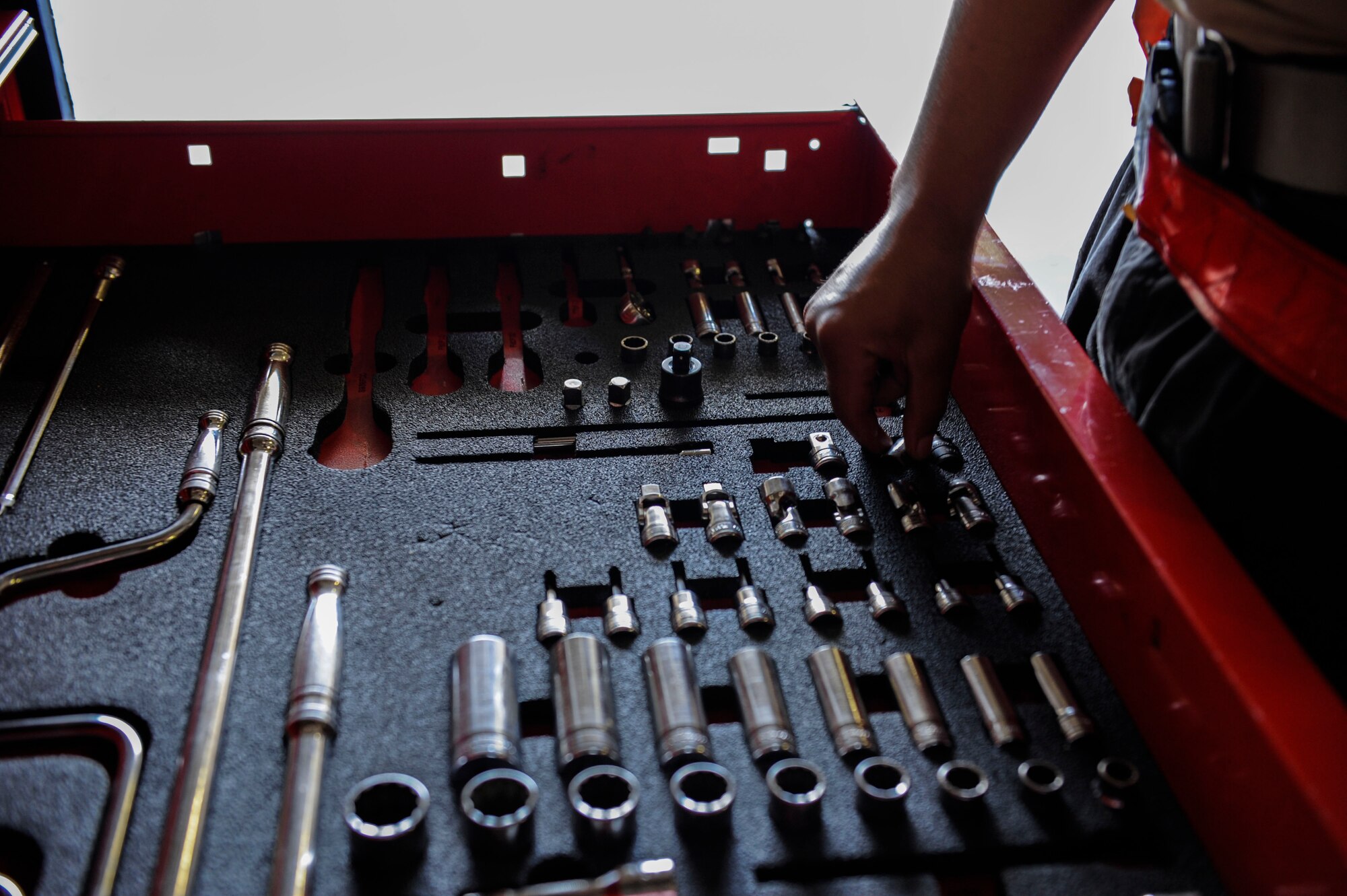 U.S. Air Force Senior Airman Devon Moore, 67th Aircraft Maintenance Unit crew chief, selects tools for maintenance training April 24, 2017, at Kadena Air Base, Japan. Selection of proper tools for tasks ensures the highest quality maintenance is performed on an aircraft. (U.S. Air Force photo by Senior Airman Lynette M. Rolen)