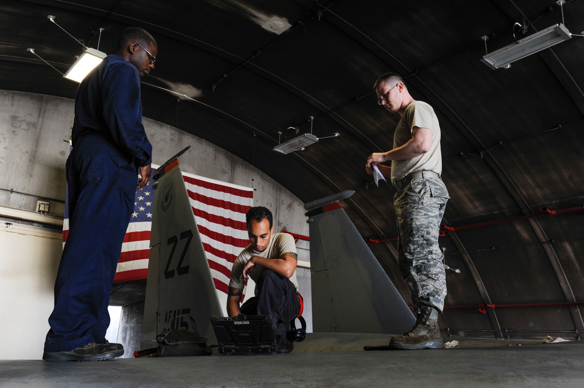 U.S. Air Force Airman 1st Class Tychaun Kingston, 44th Aircraft Maintenance Unit crew chief, Senior Airman Devon Moore, 67th AMU crew chief, and Tech. Sgt. Timothy Peppler, 372nd Training Squadron, Detachment 15, F-15 Eagle aircraft maintenance instructor, review training content April 24, 2017, at Kadena Air Base, Japan. The 372nd TRS, Det. 15, provides a multitude of courses related to F-15 Eagle maintenance, including hydraulics lessons. (U.S. Air Force photo by Senior Airman Lynette M. Rolen)