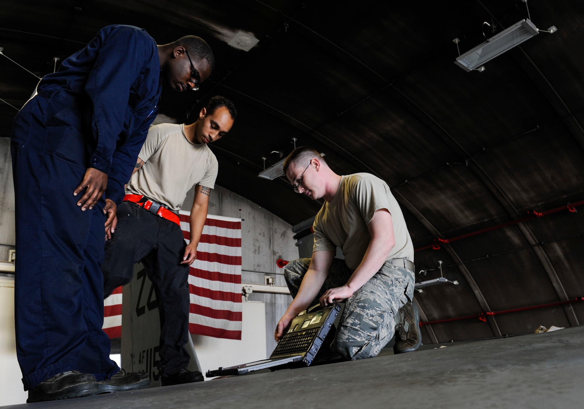 U.S. Air Force Airman 1st Class Tychaun Kingston, 44th Aircraft Maintenance Unit crew chief, Senior Airman Devon Moore, 67th AMU crew chief, and Tech. Sgt. Timothy Peppler, 372nd Training Squadron, Detachment 15, F-15 Eagle aircraft maintenance instructor, prepare to conduct maintenance training April 24, 2017, at Kadena Air Base, Japan. The 372nd TRS, Det. 15, provides upgrade training to more than 90 of Kadena’s crew chiefs annually. (U.S. Air Force photo by Senior Airman Lynette M. Rolen)