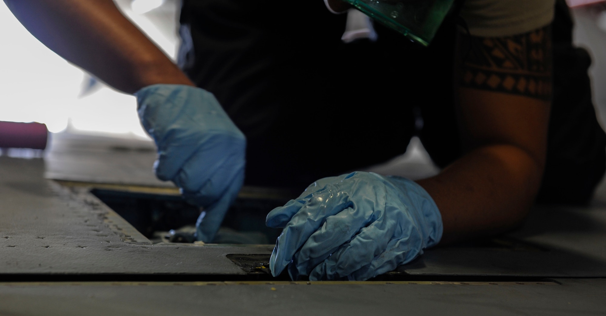 U.S. Air Force Senior Airman Devon Moore, 67th Aircraft Maintenance Unit crew chief, performs maintenance on an F-15 Eagle flap actuator April 24, 2017, at Kadena Air Base, Japan. When performing maintenance on aircraft, use of personal protective equipment is important to guaranteeing the safety of the maintainers. (U.S. Air Force photo by Senior Airman Lynette M. Rolen)