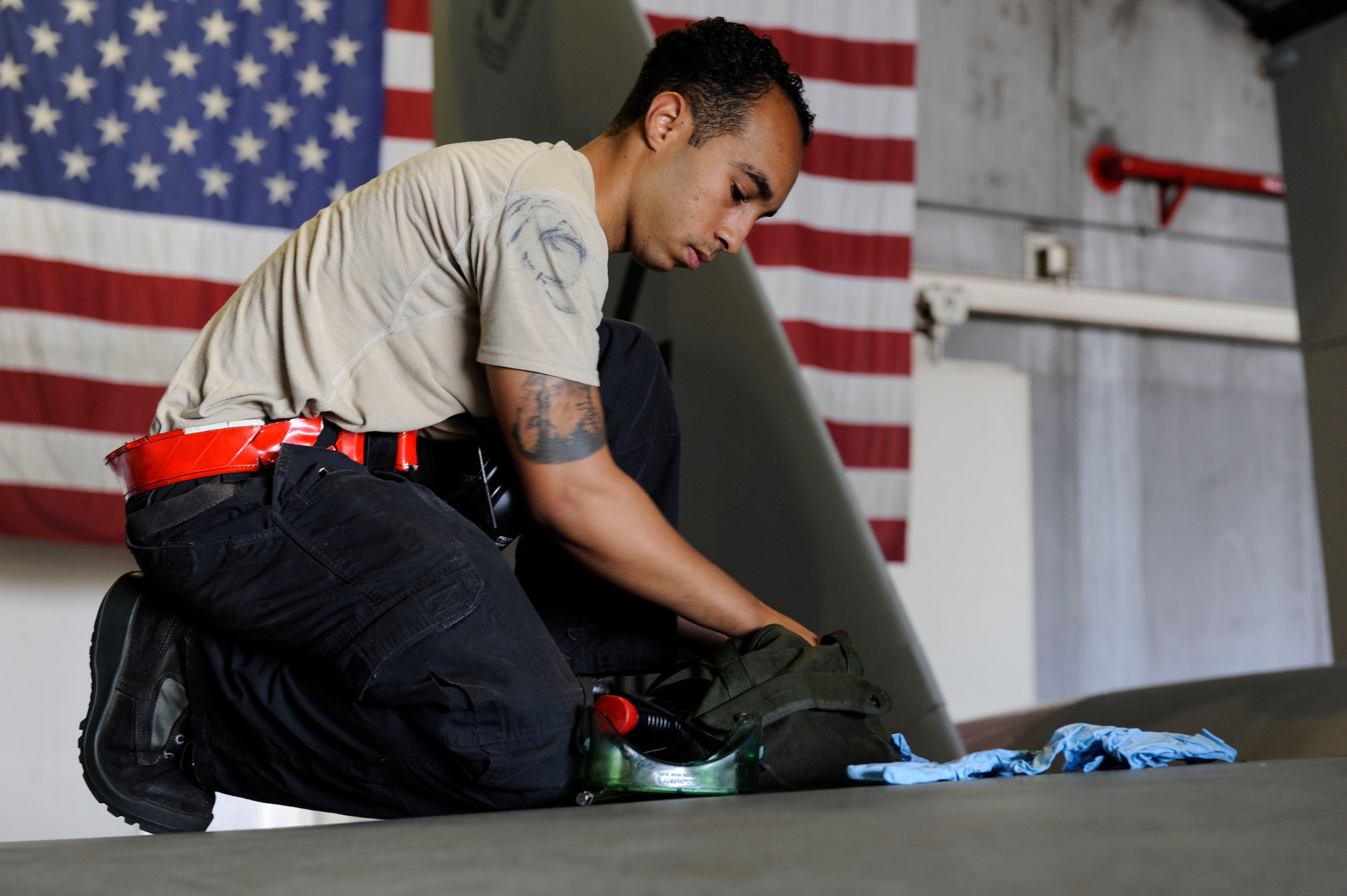 U.S. Air Force Senior Airman Devon Moore, 67th Aircraft Maintenance Unit crew chief, packs up maintenance gear April 24, 2017, at Kadena Air Base, Japan. Proper storage and transportation of tools is important for safety and security of the maintainers. (U.S. Air Force photo by Senior Airman Lynette M. Rolen)
