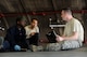 U.S. Air Force Tech. Sgt. Timothy Peppler, 372nd Training Squadron, Detachment 15, F-15 Eagle aircraft maintenance instructor, Senior Airman Devon Moore, 67th Aircraft Maintenance Unit crew chief, and Airman 1st Class Tychaun Kingston, 44th AMU crew chief, review training content April 24, 2017, at Kadena Air Base, Japan. After Airmen complete each training task, the instructor reviews their actions and provides feedback. (U.S. Air Force photo by Senior Airman Lynette M. Rolen)