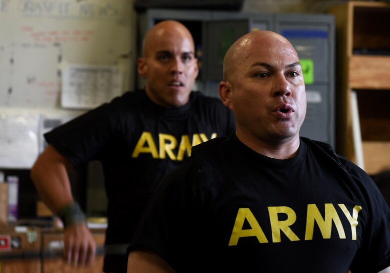 U.S. Army Master Sgt. Fernando Gonzalez, U.S. Forces Afghanistan, prepares for his next exercise during a fitness competition April 22, 2017, at Bagram Airfield, Afghanistan. Soldiers, Airmen and civilians participated in a fitness challenge, which tested their ability to perform various exercises in a designated amount of time. (U.S. Air Force photo by Staff Sgt. Benjamin Gonsier)