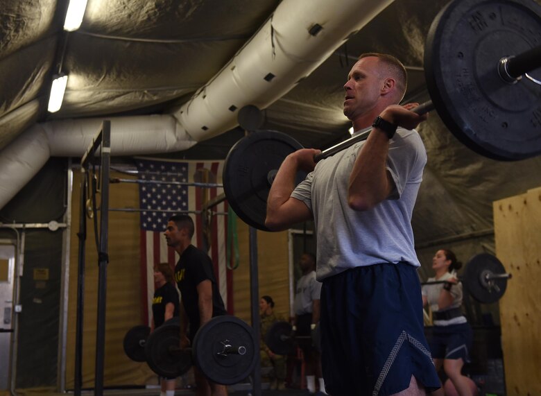 U.S. Air Force Brig. Gen. Jim Sears, 455th Air Expeditionary Wing commander, lifts a barbell during a fitness competition April 22, 2017, at Bagram Airfield, Afghanistan. During the competition, participants performed a variety of exercises including deadlifts, sit-ups and power snatches. (U.S. Air Force photo by Staff Sgt. Benjamin Gonsier)